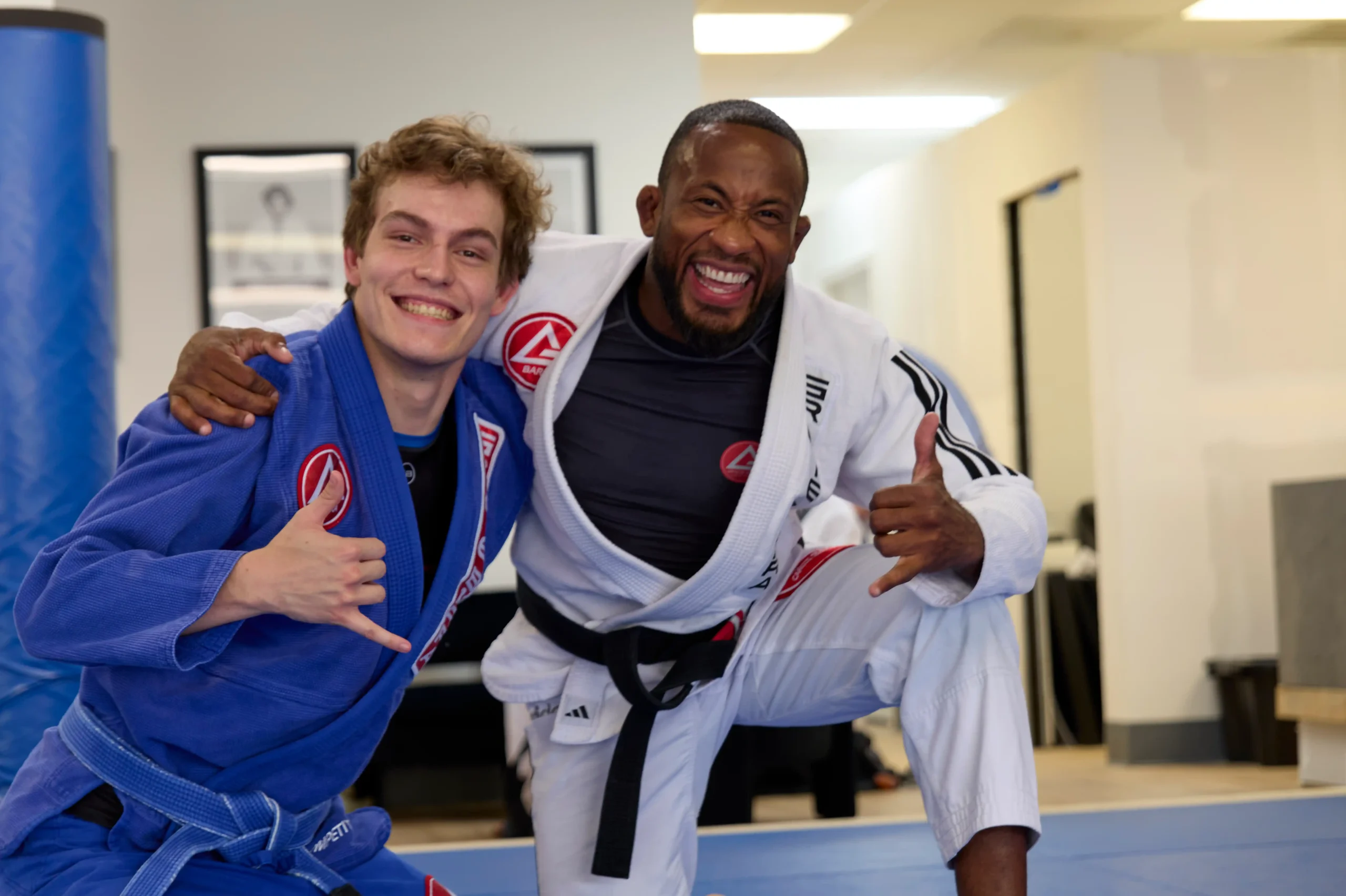 Group of martial arts students training together on the mat during a structured class session